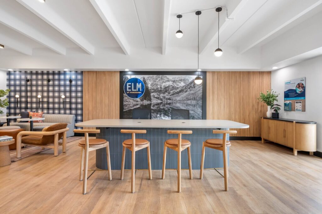 reception space with bar heigh counter and bar stool seating